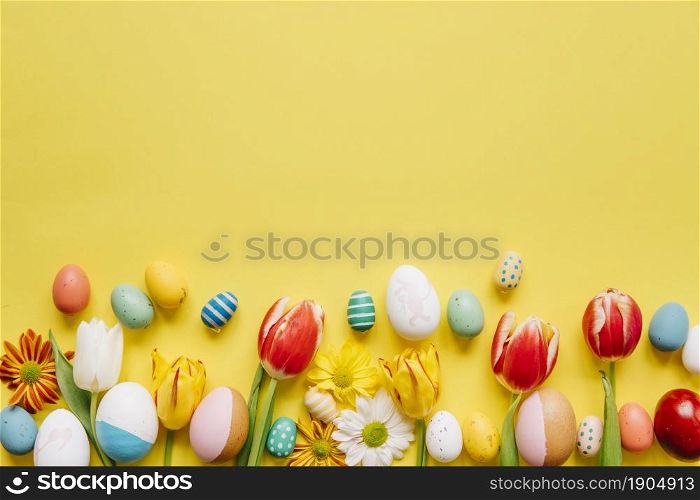bright colored eggs with flowers yellow. Beautiful photo. bright colored eggs with flowers yellow