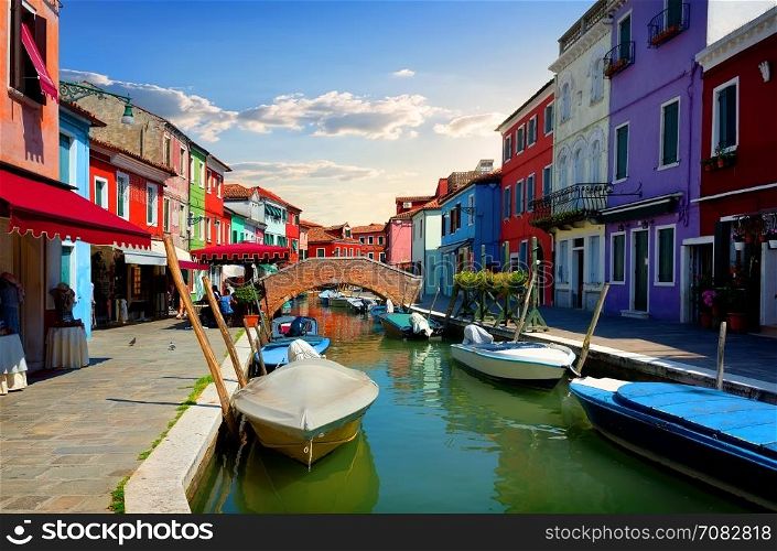 Bright colorful houses and water street in Burano, Italy