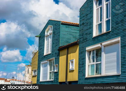 Bright colorful houses on the seaside street in the port of La Rochelle, France