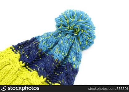 Bright colorful knitted hat with pompon isolated on white background