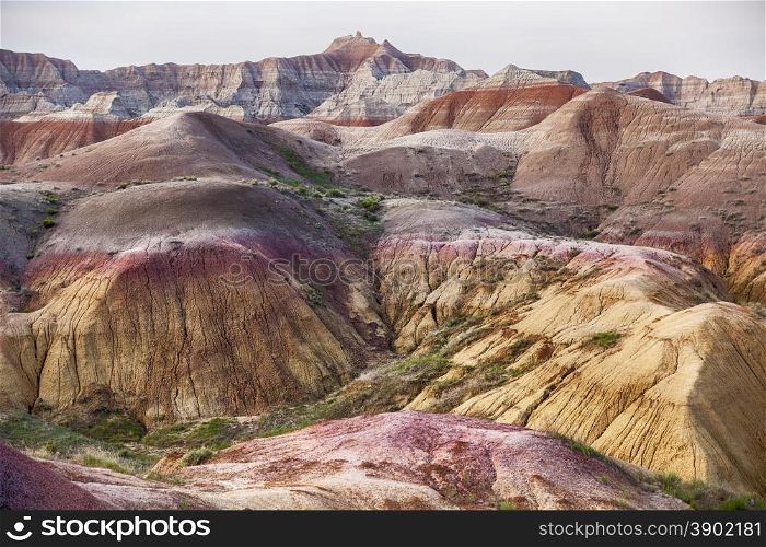 Bright colors exist in the Yellow Mounds area of the Badlands National Park. The hills here are characterized by the yellow and red colors of the weathered and eroded sediments of the ancient sea floor.&#xA;
