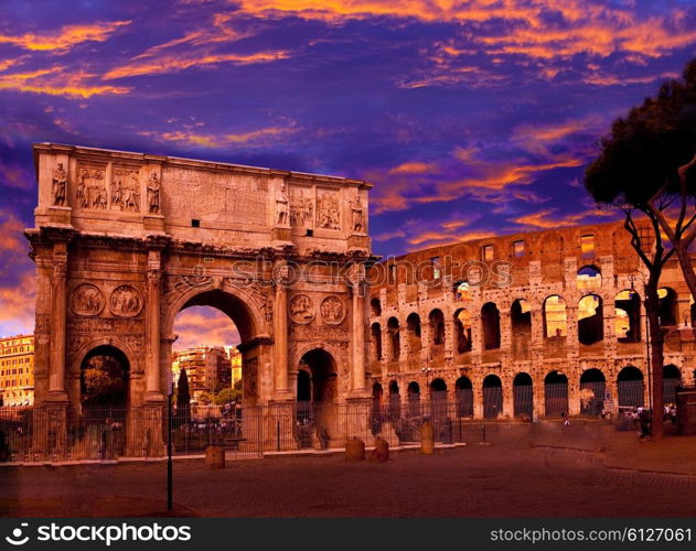 Bright crimson sunset over the ancient Colosseum and Triumphal arch. Rome. Italy