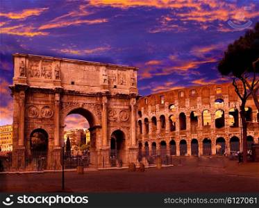 Bright crimson sunset over the ancient Colosseum and Triumphal arch. Rome. Italy