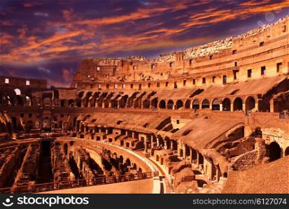 Bright crimson sunset over the ancient Colosseum. Rome. Italy