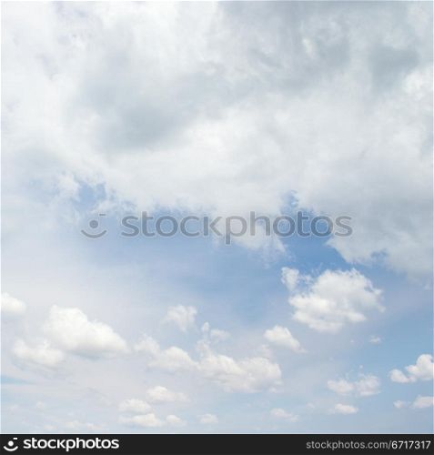 bright cumulus clouds and blue sky