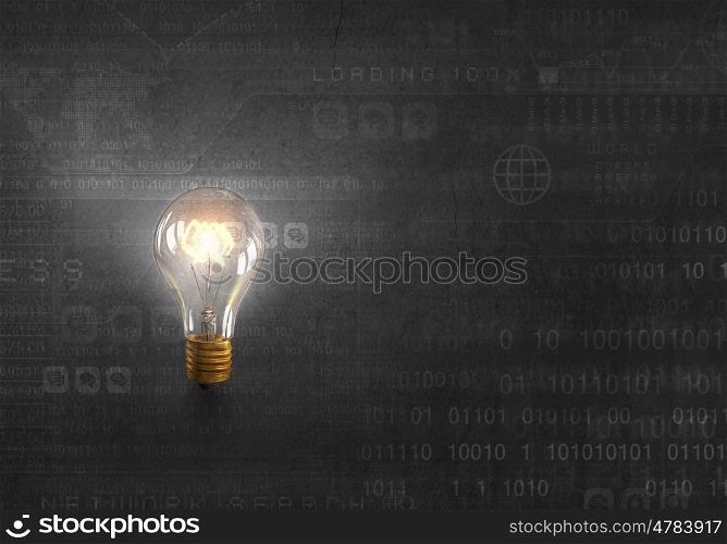 Bright electric bulb. Glowing glass light bulb on digital background
