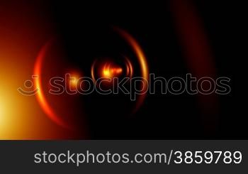 Bright fiery rings and full-spheres fly and come nearer against a dark background.