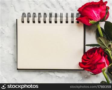 Bright flowers and a place for your congratulatory message. Closeup, view from above. No people. Concept of preparation for a holiday. Congratulations for relatives, friends and colleagues. Bright flowers and a place for your congratulatory message