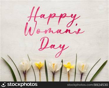 Bright flowers and Happy Women’s Day lettering. Close-up, no people, texture. Congratulations for family, relatives, friends and colleagues. Bright flowers and Happy Women’s Day lettering