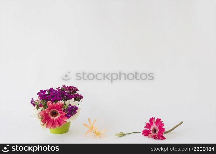bright flowers near pot
