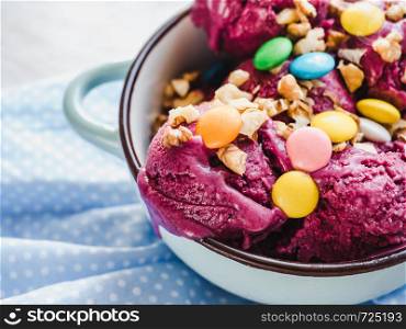 Bright, fruit ice cream on a vintage plate. White, isolated background. Close-up, top view. Concept of tasty and healthy food. Bright, fruit ice cream on a vintage plate