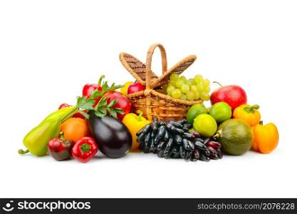 Bright fruits and vegetables in willow basket isolated on white background