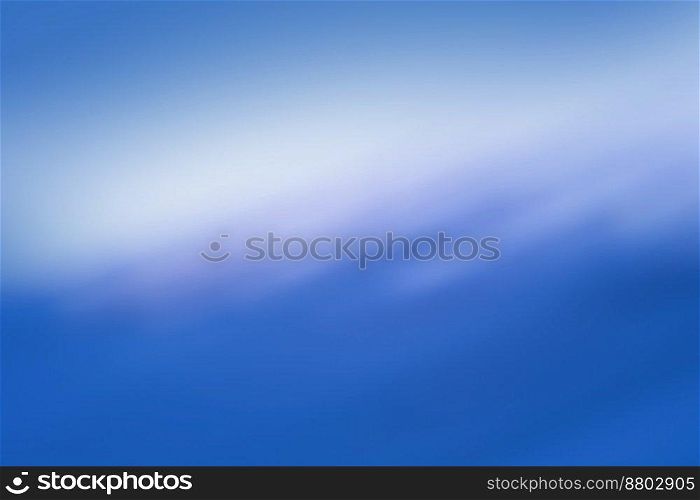 Bright glow radiance on blue blurred bokeh background. Shimmering glow sheen on blurred background.. Shining glare refulgence on a blue background