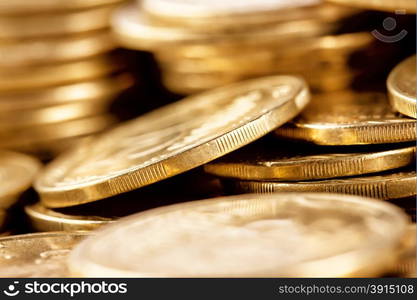 Bright golden coins shot a bunch with a blurred background. Bright golden coins shot a bunch