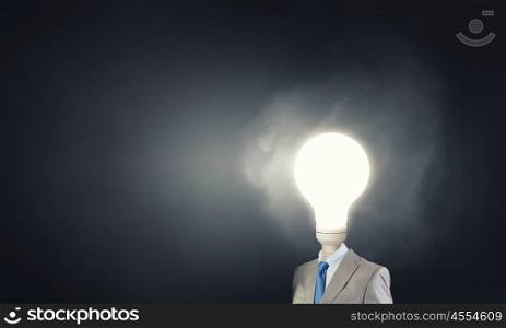 Bright head. Businessman in suit with light bulb instead of head