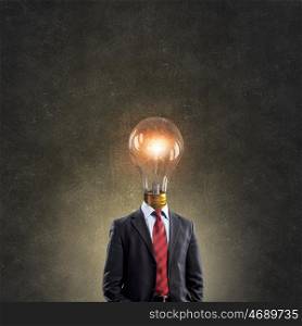 Bright head. Businessman in suit with light bulb instead of head
