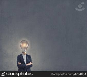 Bright head. Businesswoman in suit with light bulb instead of head