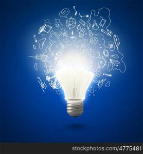 Bright idea. Conceptual image of electric bulb with business sketches