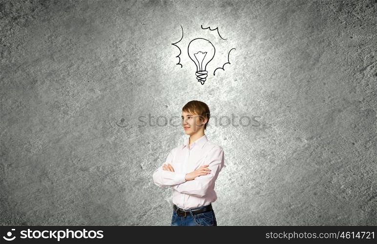 Bright idea. Confident school boy with arms crossed on chest