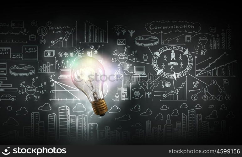 Bright idea for business growth. Glass glowing light bulb and business sketched ideas