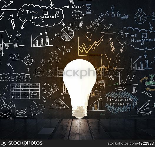 Bright idea for business growth. Silhouette of light bulb and business sketched ideas