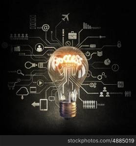 Bright idea for success. Glowing glass light bulb on computing concept background