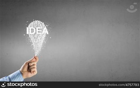 Bright idea in hand. Businessman hand holding idea light bulb concept