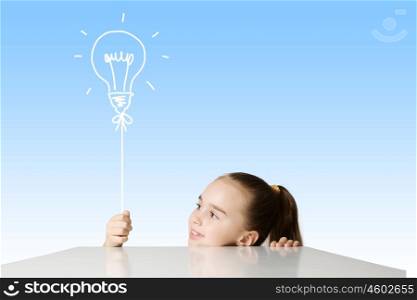 Bright idea. Little cute school girl and electric bulb