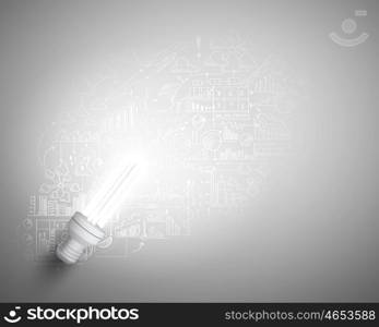 Bright ideas. Conceptual image of light bulb and business sketches