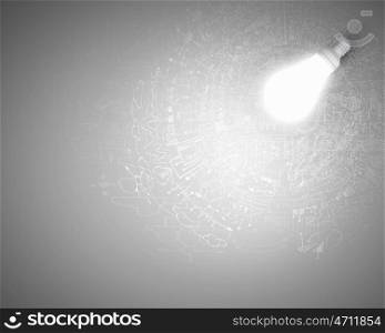 Bright ideas. Conceptual image of light bulb and business sketches