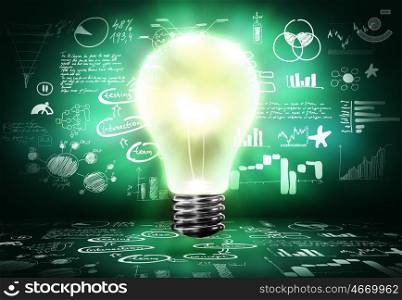 Bright ideas. Conceptual image with light bulb and business sketches
