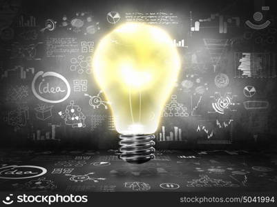 Bright ideas. Conceptual image with light bulb and business sketches