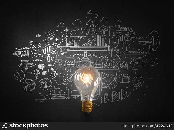 Bright ideas on wall. Glowing glass light bulb and business sketches at dark background