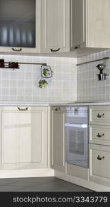 Bright interior with kitchen cabinets and wall tiles