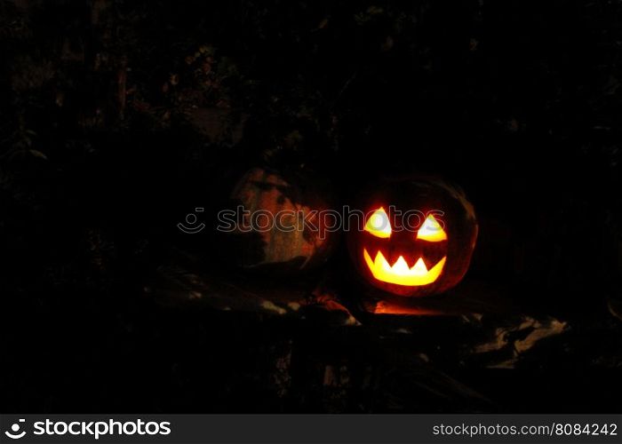 bright mask glowing on Halloween. scary ghost face glowing on Halloween in the darkness