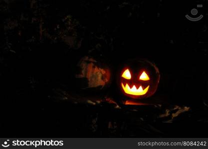 bright mask glowing on Halloween. scary ghost face glowing on Halloween in the darkness