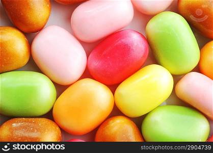 Bright multi-colour candies in sugar glaze