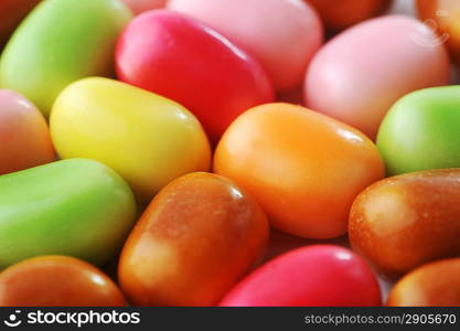 Bright multi-colour candies in sugar glaze