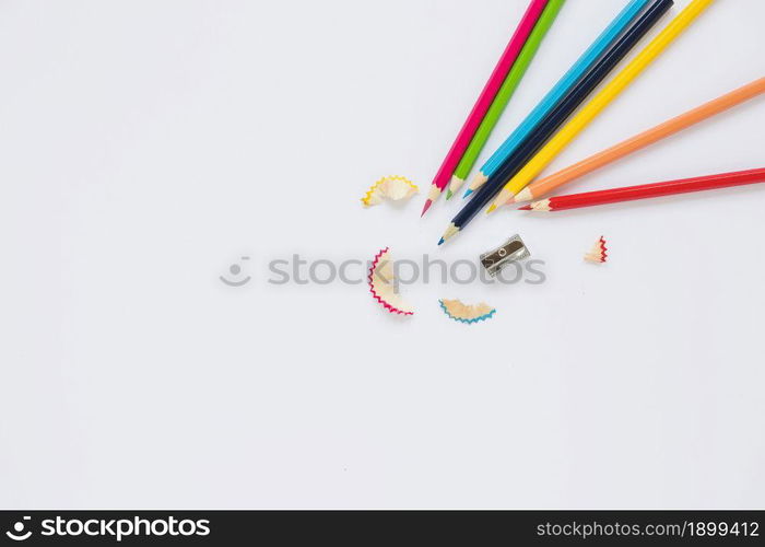 bright pencils near sharpener shaving. Resolution and high quality beautiful photo. bright pencils near sharpener shaving. High quality beautiful photo concept