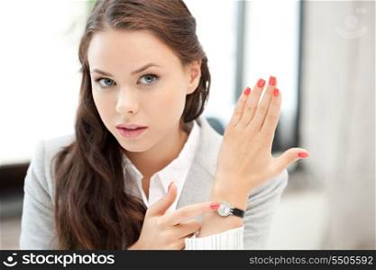 bright picture of attractive businesswoman with watch