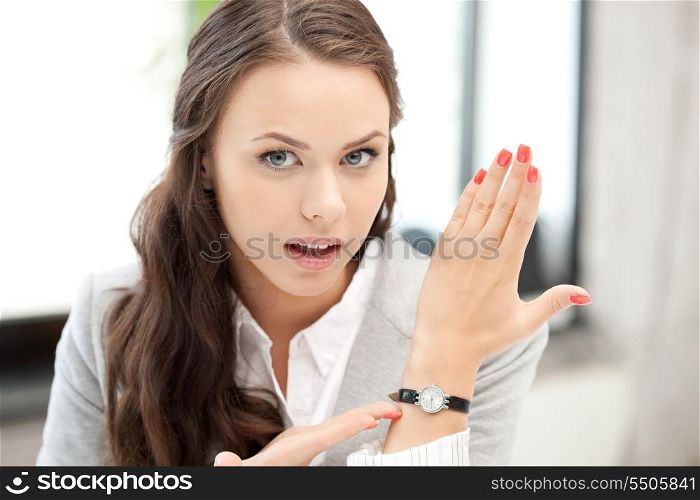 bright picture of attractive businesswoman with watch