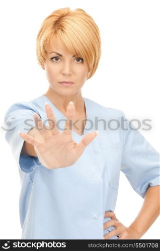 bright picture of attractive female doctor showing stop gesture&#xA;