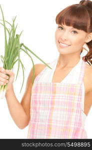 bright picture of beautiful housewife with spring onions over white&#xA;
