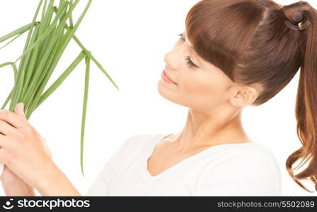 bright picture of beautiful housewife with spring onions over white&#xA;