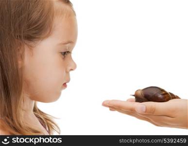 bright picture of beautiful litle girl with snail
