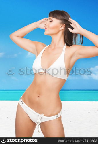 bright picture of beautiful woman in bikini on the beach