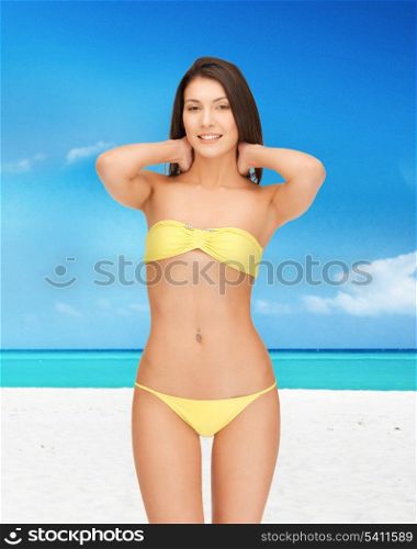 bright picture of beautiful woman in bikini on the beach