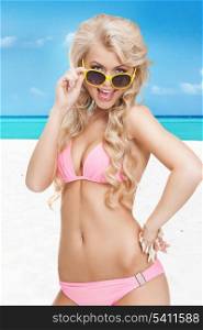bright picture of beautiful woman in bikini with sunglasses