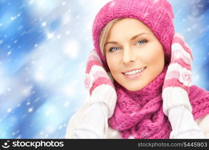 bright picture of beautiful woman in hat, muffler and mittens