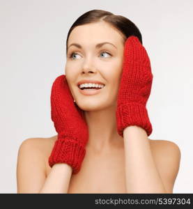 bright picture of beautiful woman in red mittens..